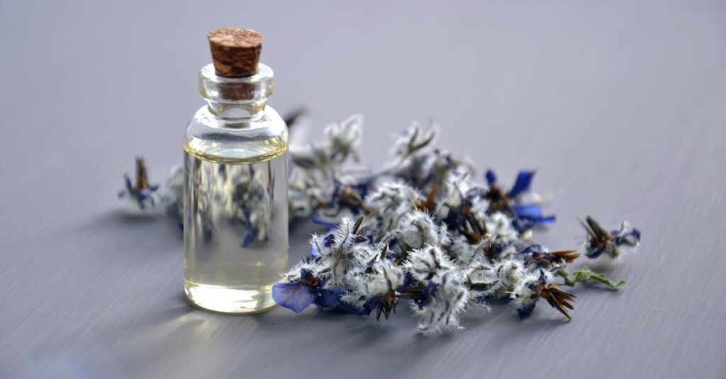 pexels-photo-932577-932577 Close-up of a lavender oil bottle with dried flowers for aromatherapy. Perfect for wellness themes.
